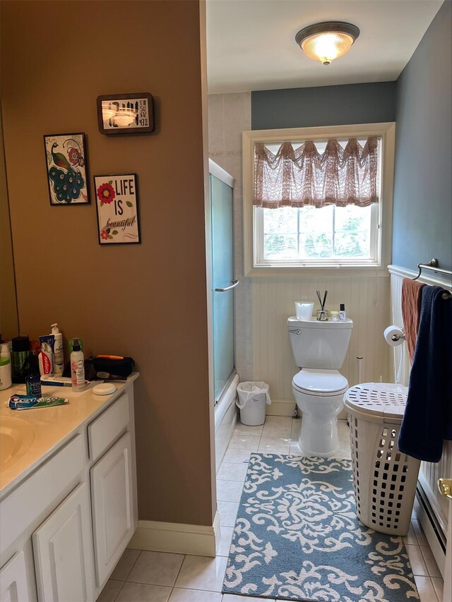 36VANDERBILT 36 Vanderbilt Ave, Saint James, NY 11780 - full bath with a baseboard heating unit, tile patterned floors, vanity, and toilet