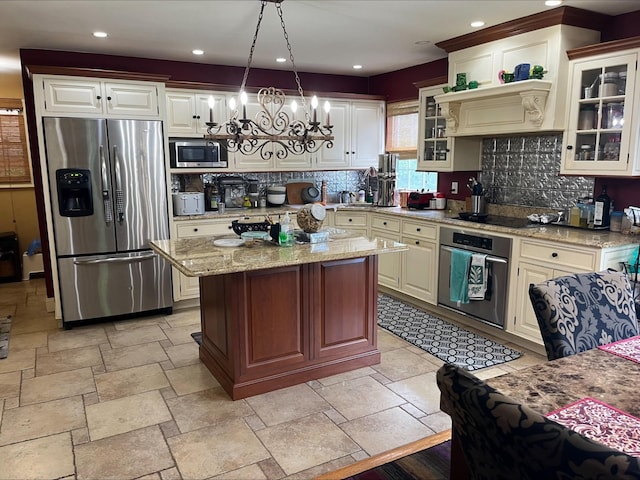 36VANDERBILT 36 Vanderbilt Ave, Saint James, NY 11780 - kitchen with appliances with stainless steel finishes, a center island, a chandelier, tasteful backsplash, and recessed lighting