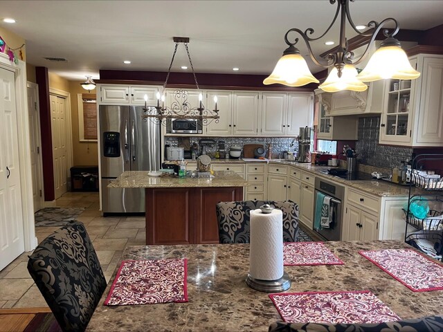 36VANDERBILT 36 Vanderbilt Ave, Saint James, NY 11780 - kitchen featuring appliances with stainless steel finishes, a chandelier, decorative backsplash, glass insert cabinets, and recessed lighting