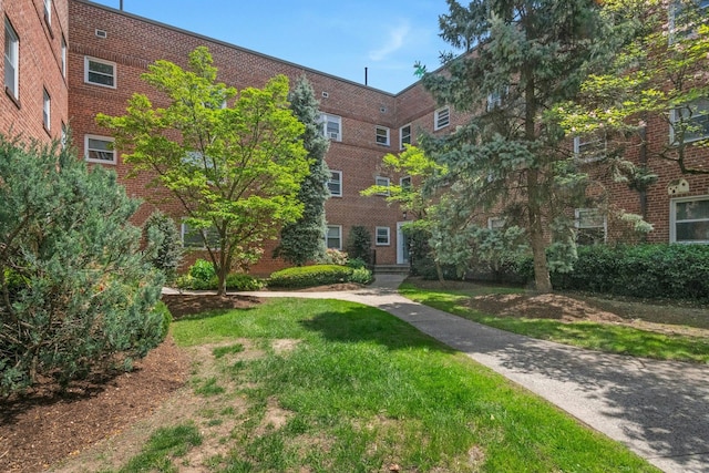 view of property's community with a lawn