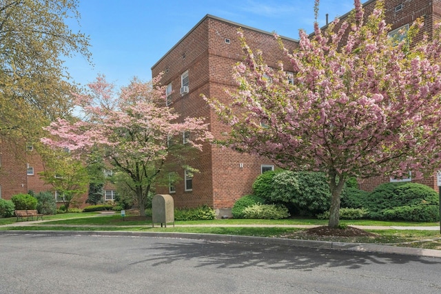 view of side of home featuring brick siding