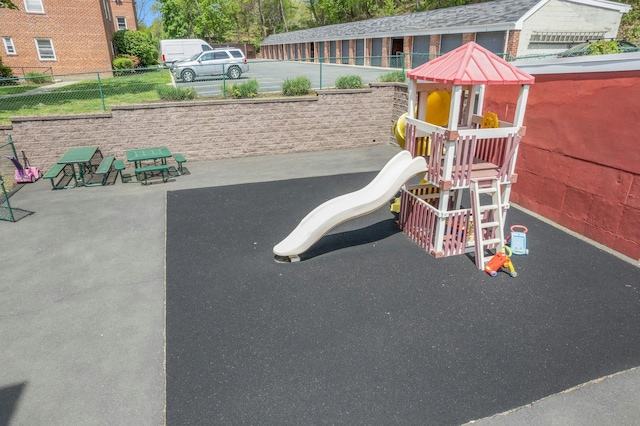 view of play area featuring fence