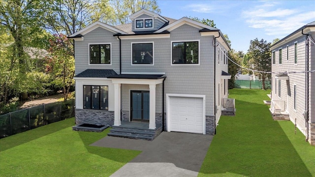 978 Singleton Ave, Woodmere, NY 11598 - contemporary house with an attached garage, stone siding, and driveway