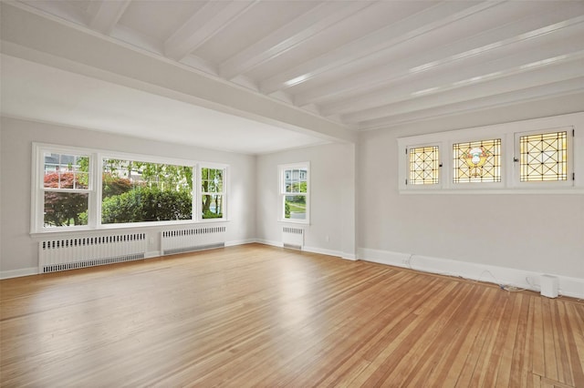 224 Leicester St, Port Chester, NY 10573 - spare room featuring radiator, beamed ceiling, wood finished floors, and baseboards