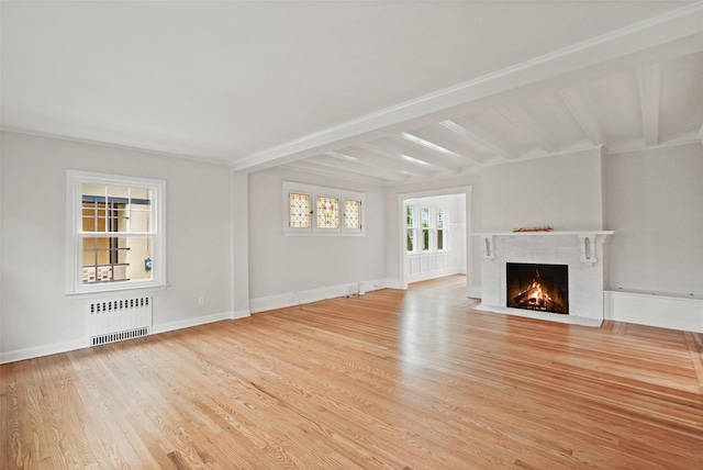 224 Leicester St, Port Chester, NY 10573 - unfurnished living room with radiator, a fireplace with flush hearth, wood finished floors, beamed ceiling, and baseboards