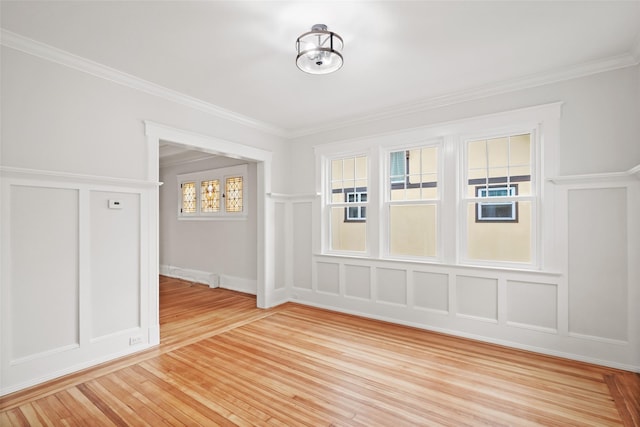 224 Leicester St, Port Chester, NY 10573 - unfurnished room featuring a decorative wall, crown molding, and light wood finished floors