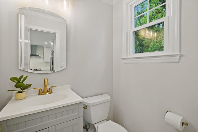 224 Leicester St, Port Chester, NY 10573 - half bath featuring toilet, vanity, and ornamental molding