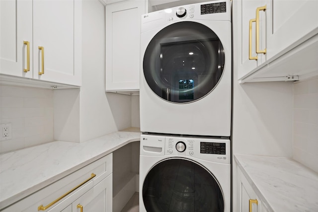 224 Leicester St, Port Chester, NY 10573 - washroom with stacked washing machine and dryer and cabinet space