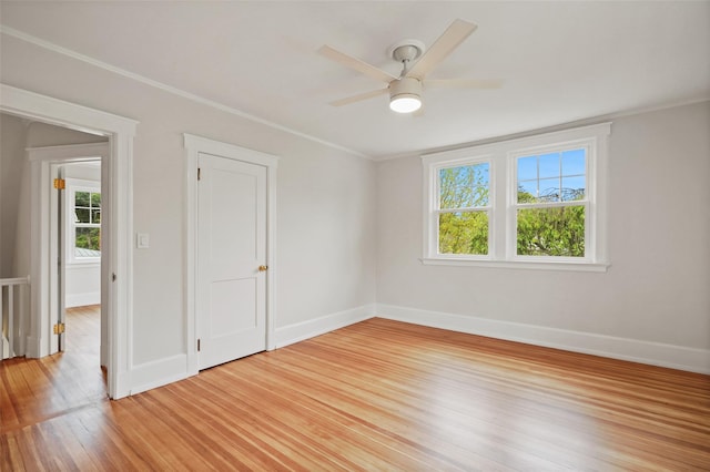 224 Leicester St, Port Chester, NY 10573 - spare room with healthy amount of natural light, light wood finished floors, baseboards, crown molding, and a ceiling fan