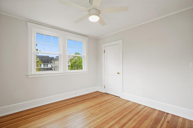 224 Leicester St, Port Chester, NY 10573 - empty room with light wood finished floors, baseboards, ceiling fan, and ornamental molding