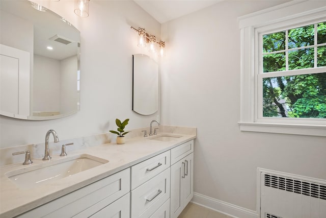 224 Leicester St, Port Chester, NY 10573 - full bathroom featuring radiator, double vanity, and baseboards