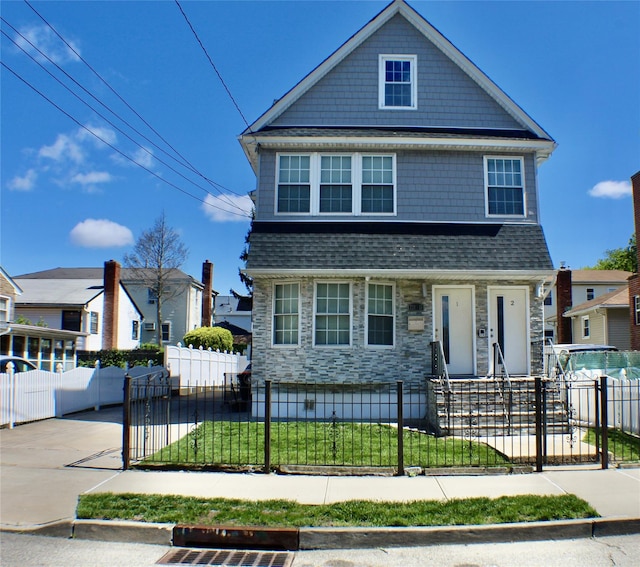 221-11 146th Ave, Springfield Gardens, NY 11413 - view of front of property featuring stone siding and roof with shingles