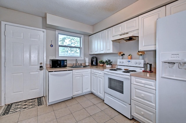 80 Saint Anns Ave, Copiague, NY 11726 - kitchen with white appliances, under cabinet range hood, a sink, white cabinets, and a textured ceiling