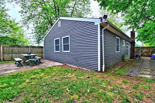 80 Saint Anns Ave, Copiague, NY 11726 - view of property exterior with fence and a patio area
