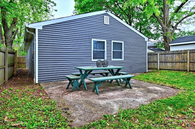 80 Saint Anns Ave, Copiague, NY 11726 - view of outbuilding featuring a fenced backyard and outdoor dining area