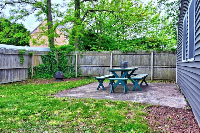 80 Saint Anns Ave, Copiague, NY 11726 - fenced backyard featuring a patio area and outdoor dining area