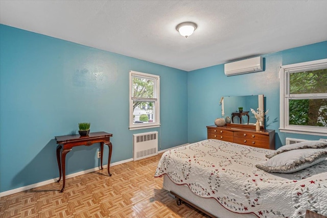 39-27 216th St, Bayside, NY 11361 - bedroom with radiator heating unit, a wall mounted AC, a textured ceiling, and baseboards