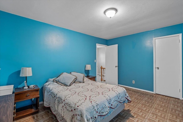 39-27 216th St, Bayside, NY 11361 - bedroom with a textured ceiling and baseboards