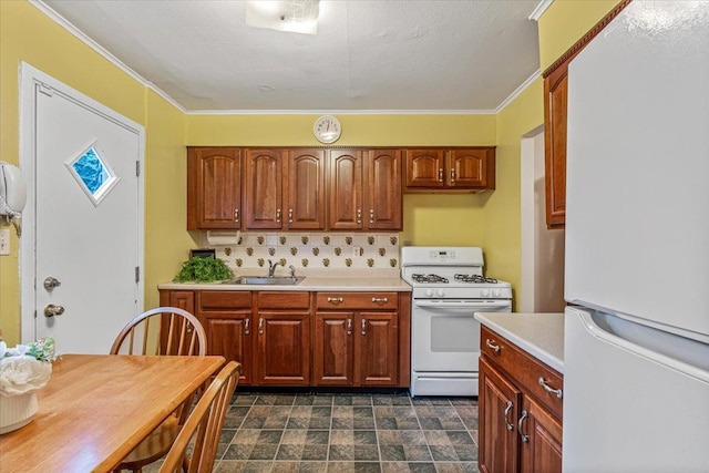 39-27 216th St, Bayside, NY 11361 - kitchen with white appliances, light countertops, a sink, stone finish flooring, and ornamental molding