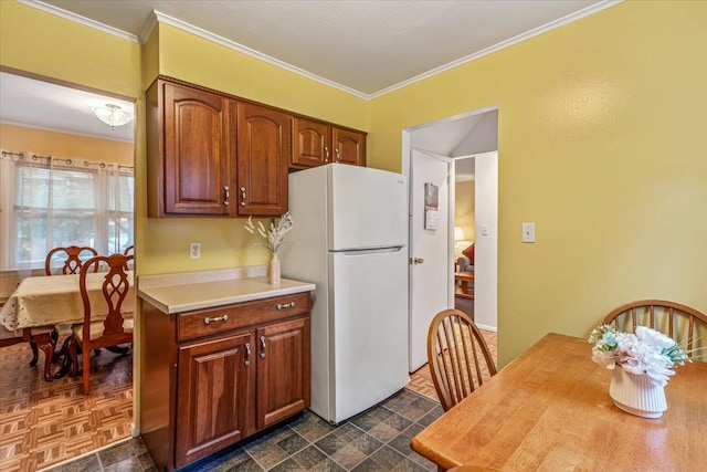 39-27 216th St, Bayside, NY 11361 - kitchen with freestanding refrigerator, light countertops, ornamental molding, and brown cabinetry