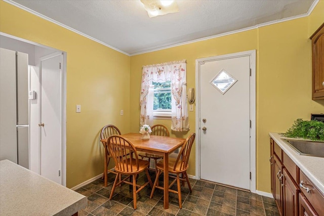 39-27 216th St, Bayside, NY 11361 - dining room with baseboards, stone finish flooring, and crown molding
