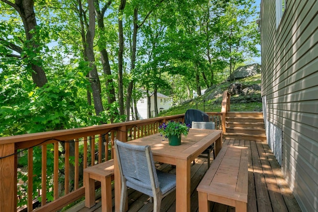 wooden deck with outdoor dining area