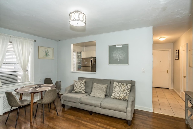 living room featuring baseboards and wood finished floors