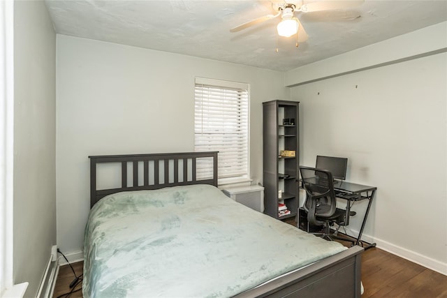 bedroom featuring baseboards, ceiling fan, and dark wood-style floors