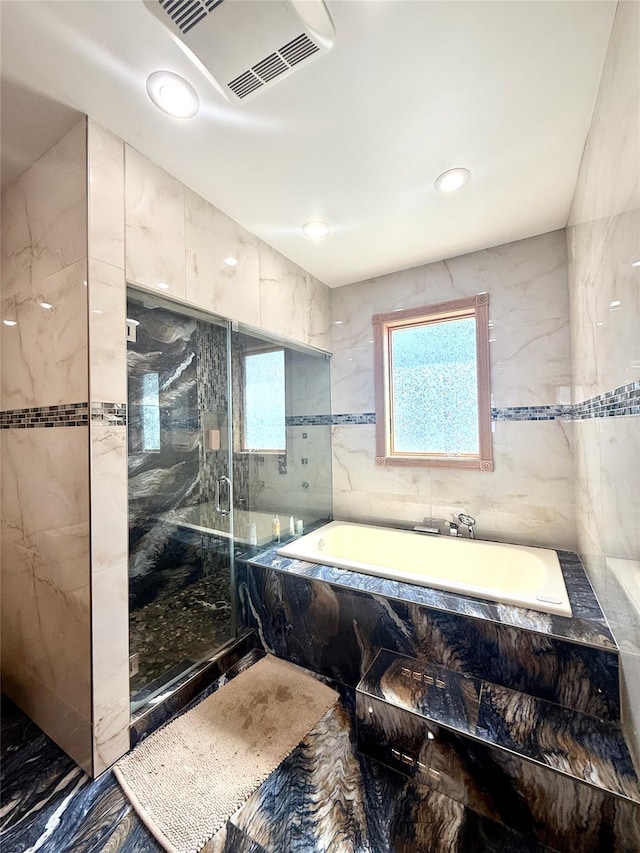 1601 Union Ave, Hewlett, NY 11557 - full bath with tile walls, marble finish floor, a wealth of natural light, visible vents, and a marble finish shower