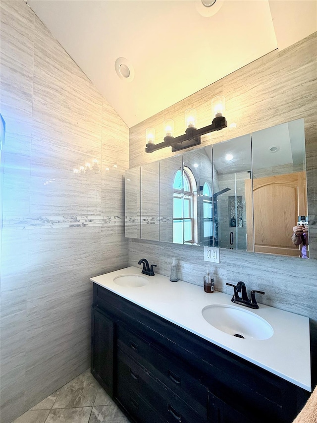 1601 Union Ave, Hewlett, NY 11557 - full bath featuring double vanity, tile walls, vaulted ceiling, and a sink