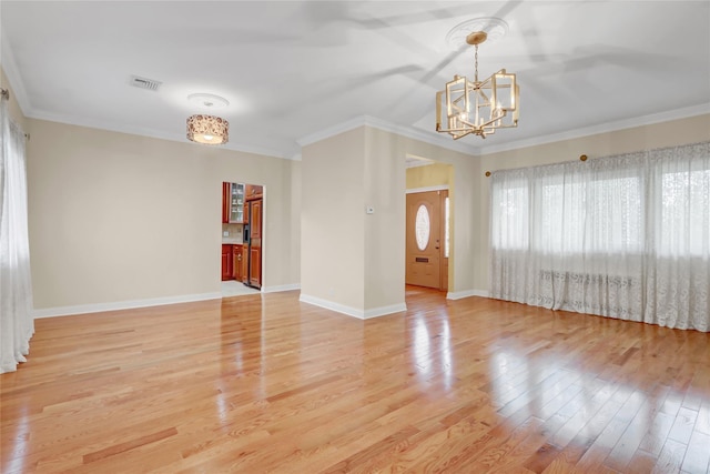 interior space with visible vents, a chandelier, crown molding, baseboards, and light wood-style floors