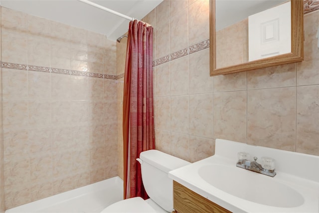 bathroom with toilet, vanity, tile walls, and a shower stall