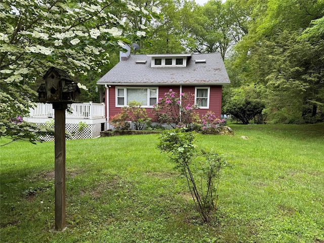 41 Birch Trl, Carmel, NY 10512 - view of front of property featuring a wooden deck, a front yard, a chimney, and a shingled roof