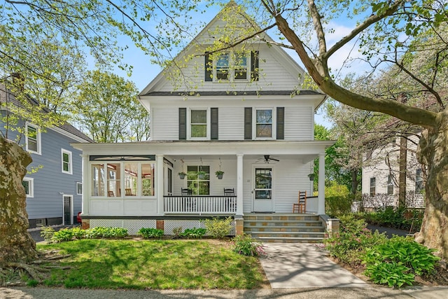 traditional style home featuring a porch and a ceiling fan
