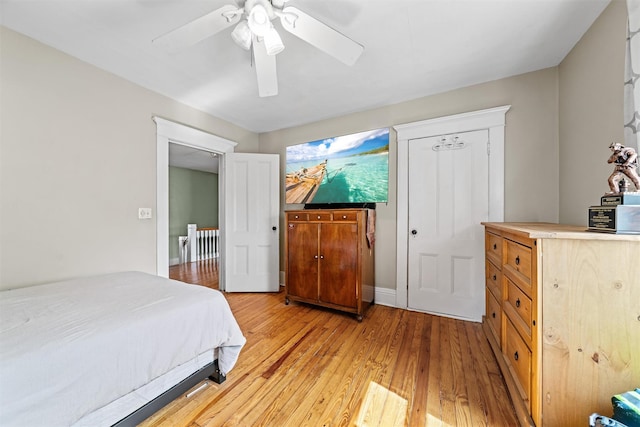 bedroom with ceiling fan and light wood-type flooring
