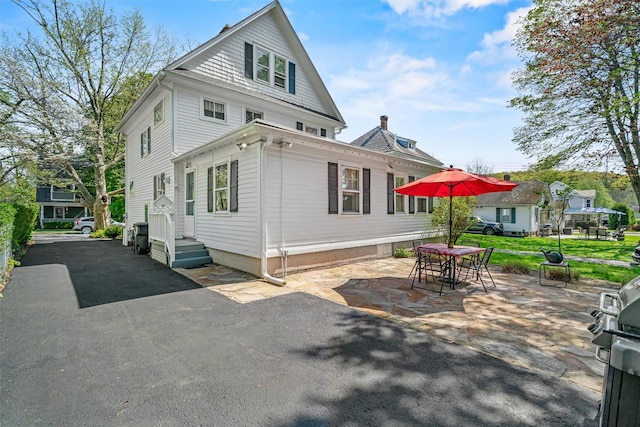 back of house featuring a patio