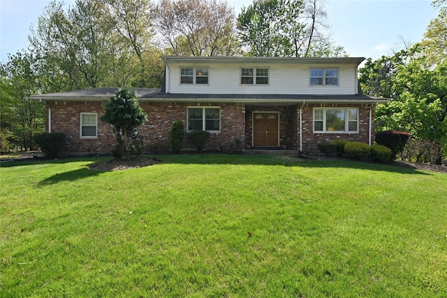 11 Sterling Rd, Spring Valley, NY 10977 - traditional-style house with a front yard and brick siding