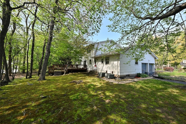 11 Sterling Rd, Spring Valley, NY 10977 - view of grassy yard with a wooden deck and central AC