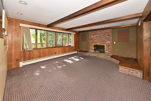 11 Sterling Rd, Spring Valley, NY 10977 - unfurnished living room with wood walls, a baseboard heating unit, carpet, a brick fireplace, and beam ceiling