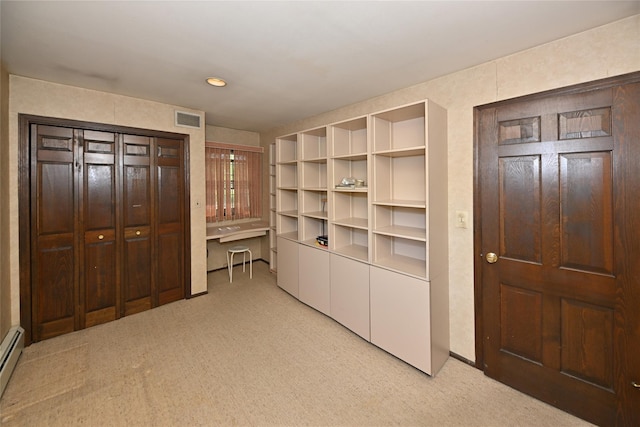 11 Sterling Rd, Spring Valley, NY 10977 - unfurnished bedroom with light carpet, baseboard heating, and recessed lighting