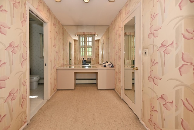 11 Sterling Rd, Spring Valley, NY 10977 - corridor with baseboard heating, wallpapered walls, baseboards, and light carpet