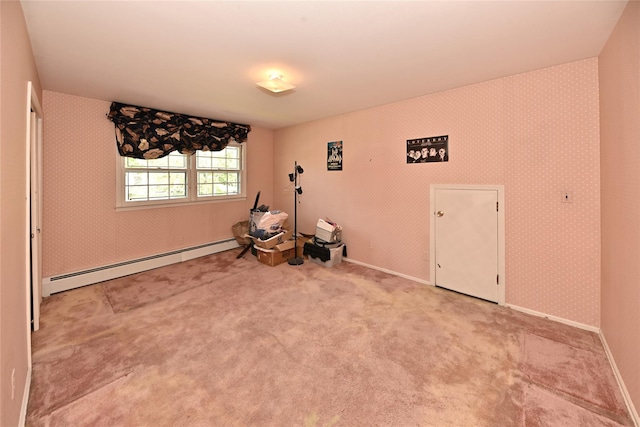 11 Sterling Rd, Spring Valley, NY 10977 - empty room with baseboard heating, carpet, wallpapered walls, and baseboards
