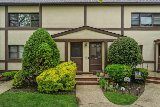274 Cherry Valley Ave Unit B-2, Garden City, NY 11530 - view of front of home with stucco siding and a shingled roof