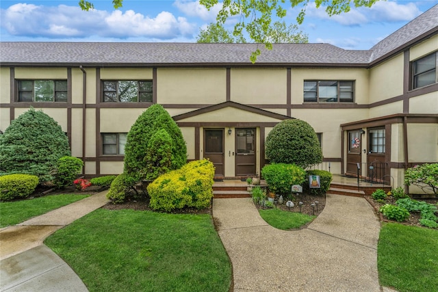 274 Cherry Valley Ave Unit B-2, Garden City, NY 11530 - view of front facade featuring stucco siding and roof with shingles