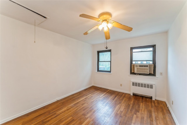 274 Cherry Valley Ave Unit B-2, Garden City, NY 11530 - spare room featuring radiator heating unit, attic access, hardwood / wood-style floors, cooling unit, and baseboards