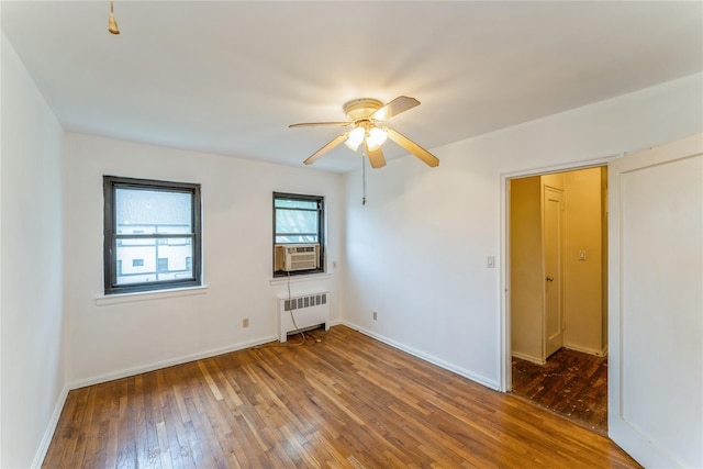 274 Cherry Valley Ave Unit B-2, Garden City, NY 11530 - empty room with radiator, hardwood / wood-style flooring, ceiling fan, and baseboards