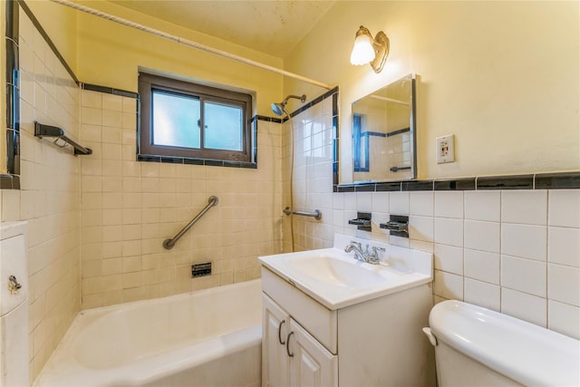 274 Cherry Valley Ave Unit B-2, Garden City, NY 11530 - full bathroom featuring vanity, toilet, tile walls, and washtub / shower combination