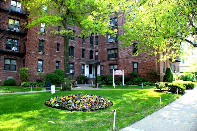 view of home's community with a lawn
