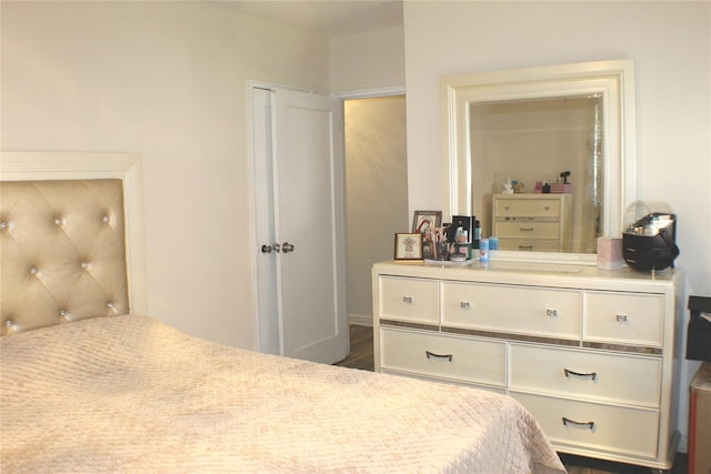 bedroom with wood finished floors