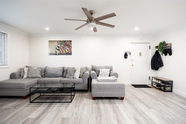 living room with ornamental molding, wood finished floors, ceiling fan, recessed lighting, and baseboards